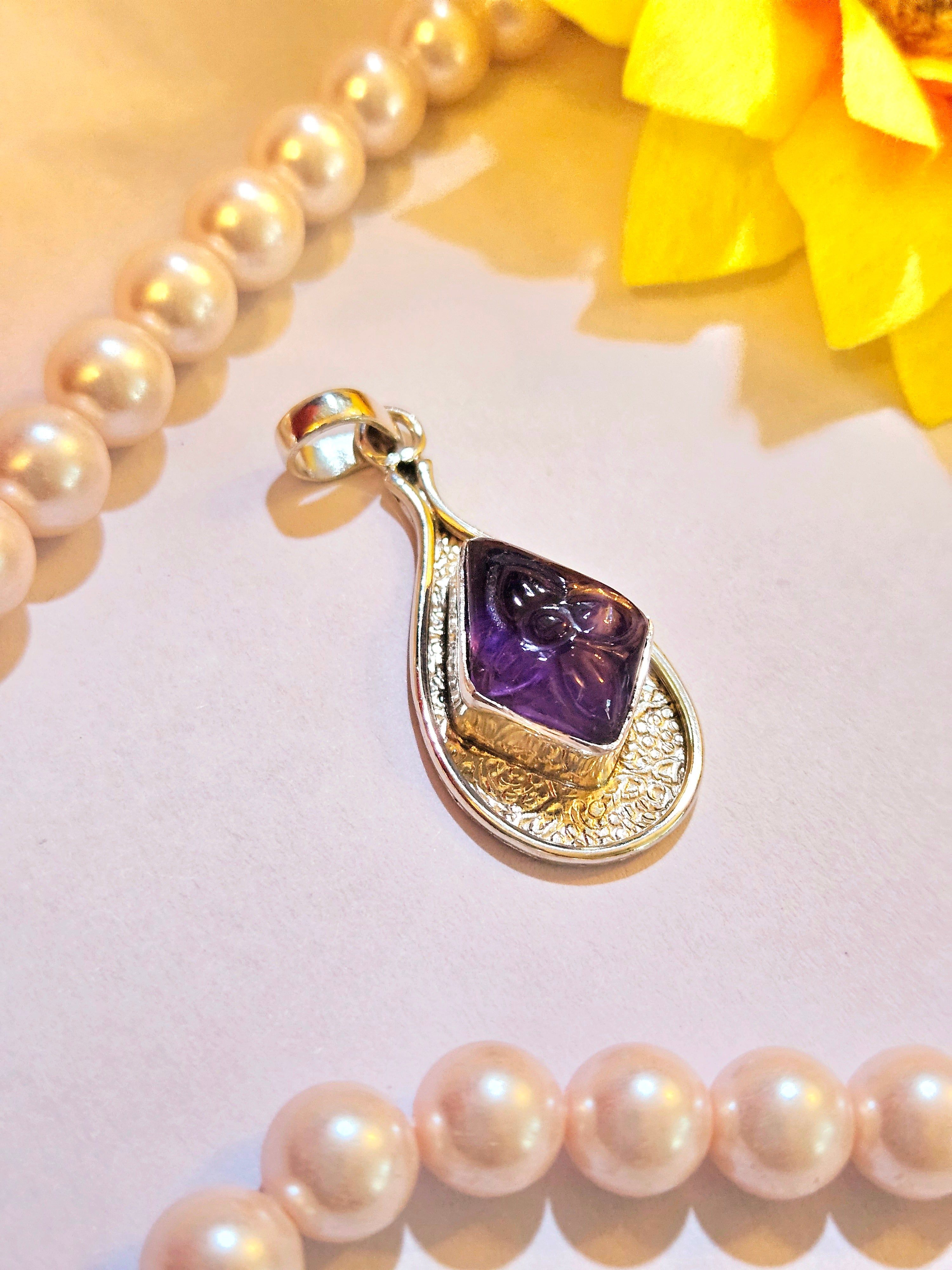 Carved Amethyst Diamond shape Pendant