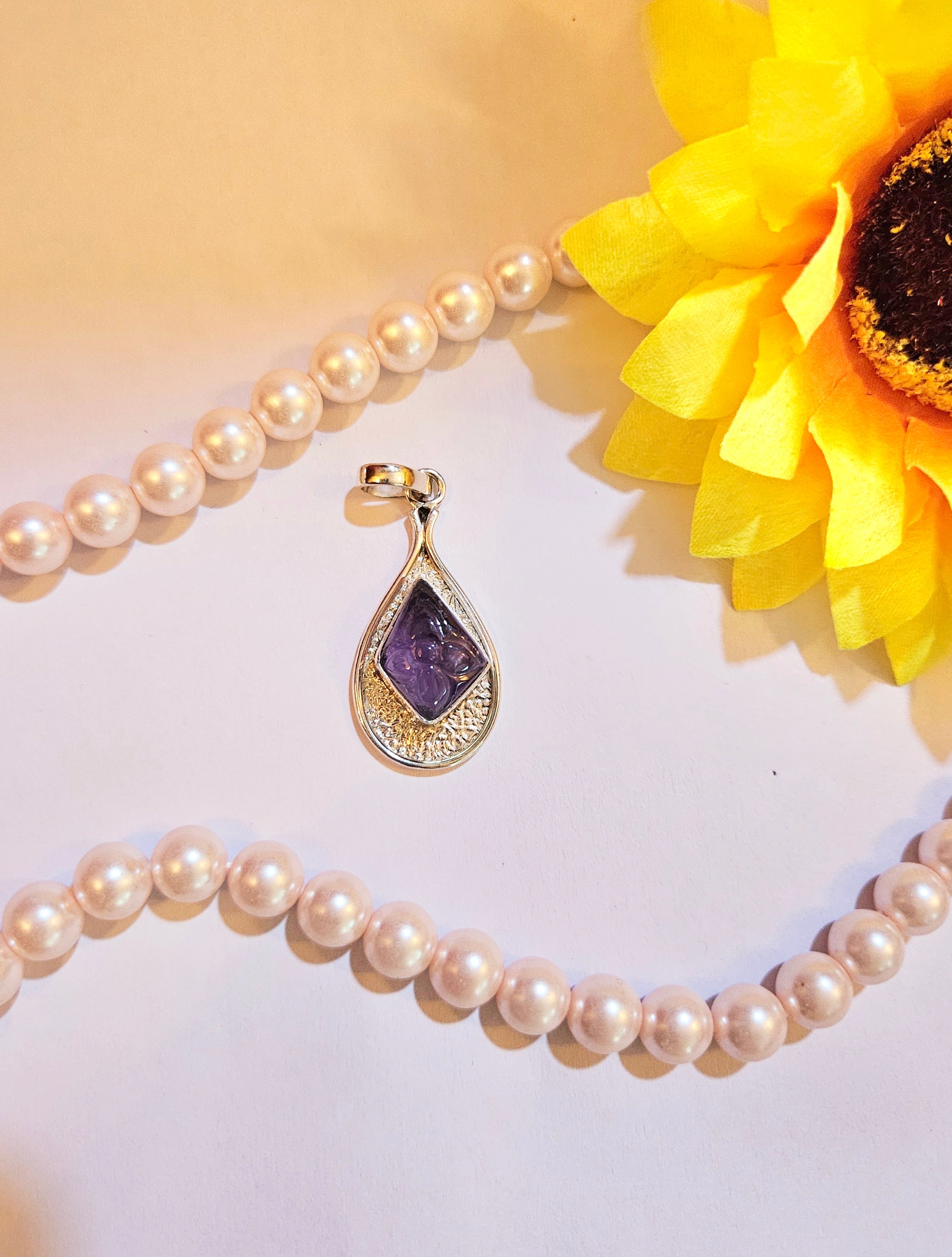 Carved Amethyst Diamond shape Pendant