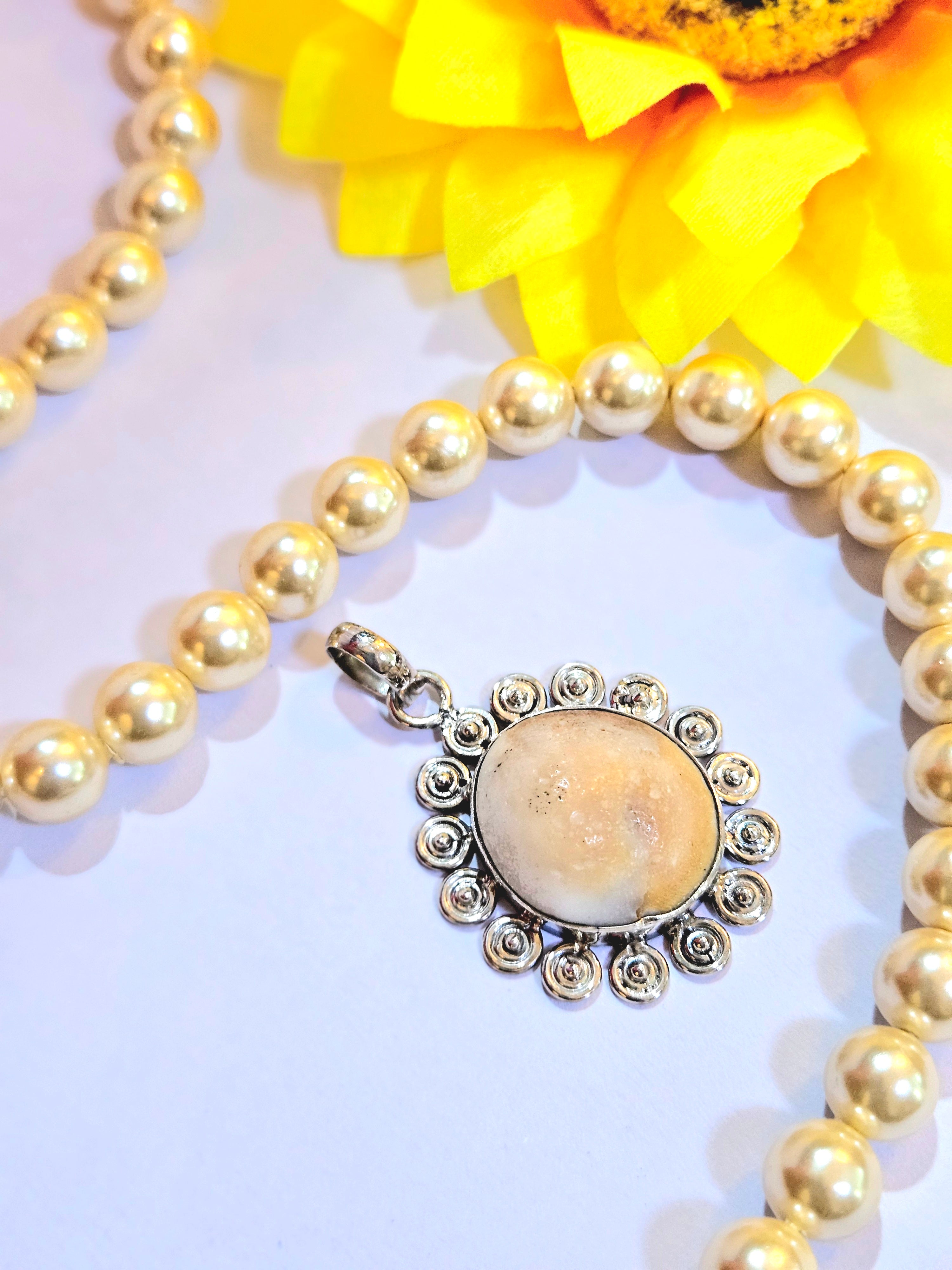 Gomti Chakra Silver Pendant